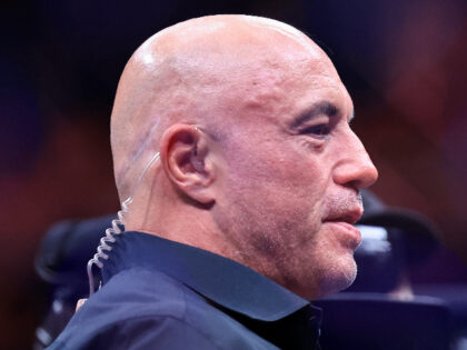 CHICAGO, ILLINOIS - AUGUST 16: Joe Rogan looks on during UFC 319 at the United Center on A