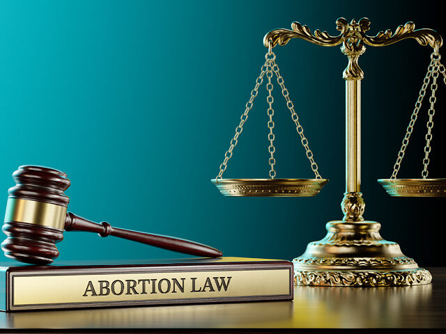 Abortion law: Judge's Gavel as a symbol of legal system, Scales of justice and wooden stan