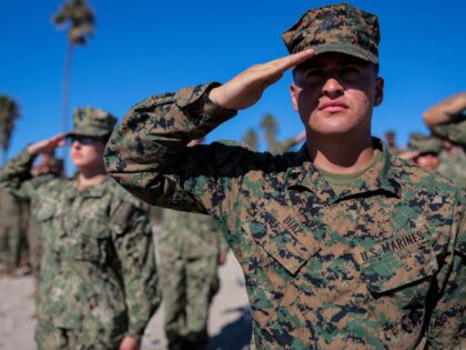 OCEANSIDE, CALIFORNIA - OCTOBER 18: U.S. Marines and Sailors salute during the national an