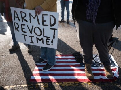 MINNEAPOLIS, MINNESOTA - JANUARY 09: Demonstrators protest outside of the Bishop Henry Whi