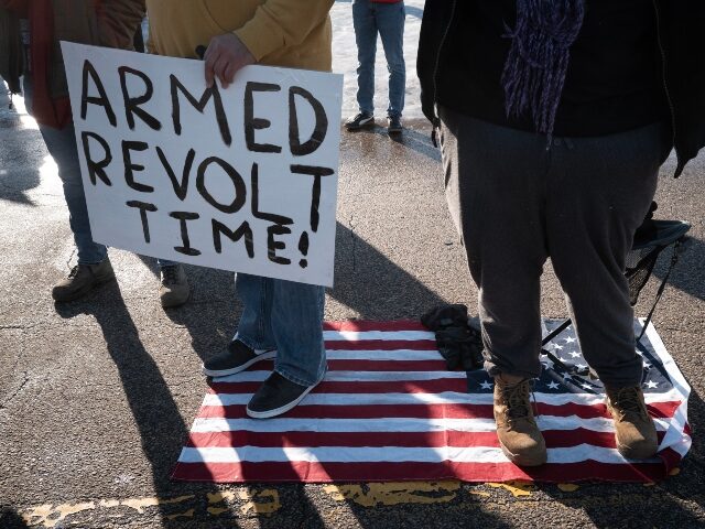 MINNEAPOLIS, MINNESOTA - JANUARY 09: Demonstrators protest outside of the Bishop Henry Whi