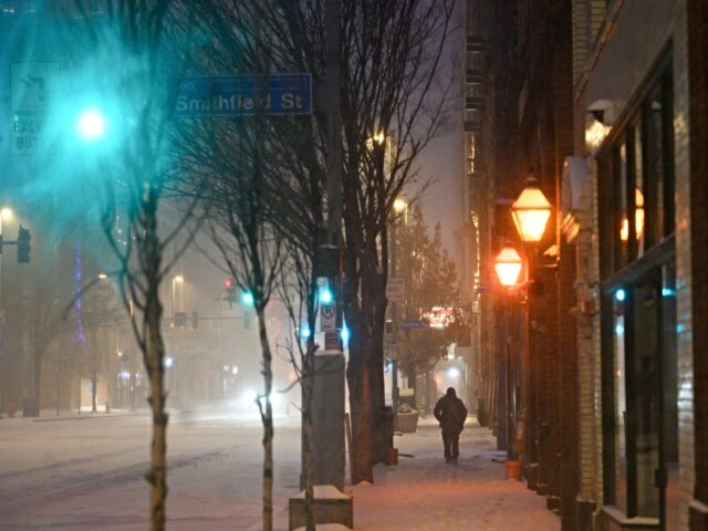 A pedestrian during a winter storm in downtown Pittsburgh, Pennsylvania, US, on Sunday, Ja