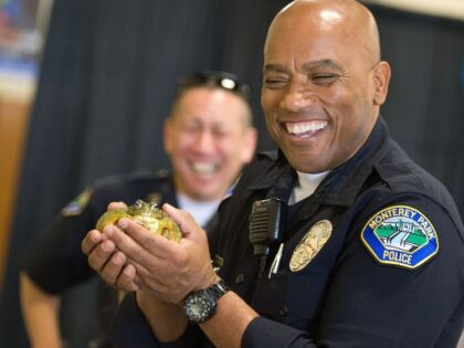 police holding a frog