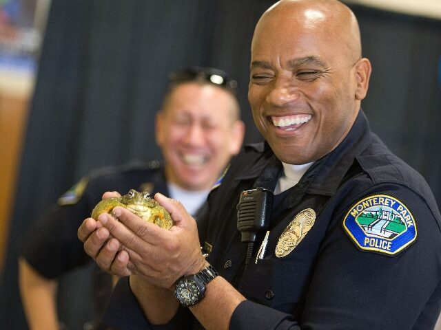 police holding a frog