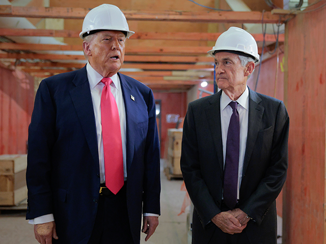 President Donald Trump speaks with Federal Reserve Chair Jerome Powell as they tour the Fe