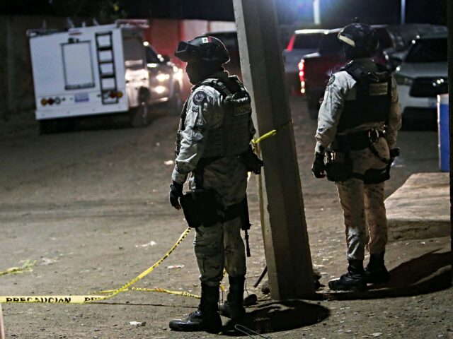 soccer mexico Members of the National Guard stand at the crime scene where at least 11 people were kille