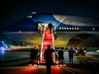 President Donald Trump disembarks Air Force One at Joint Base Andrews to board a backup pl