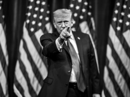 President Donald Trump gestures to the crowd after delivering remarks at the House GOP Mem