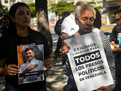 CARACAS, VENEZUELA - JANUARY 20: Women holding posters of their relatives during a protest