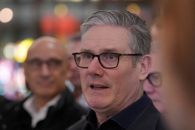 Britain's Prime Minister Keir Starmer spoke to reporters aboard a plane bound for Chi