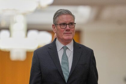 Britain's Prime Minister Keir Starmer walks to his meeting with China's Presiden