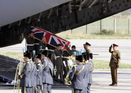 The coffin containing Joseph David Windall of the British Royal Marines arrived at a base