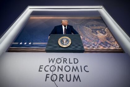 Donald Trump addressing last year's World Economic Forum in Davos via a giant video s