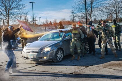 Federal agents use pepper spray against a protester outside an ICE facility in Minneapolis