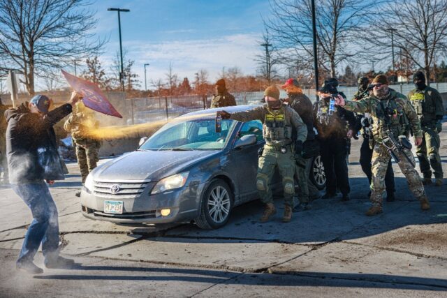Federal agents use pepper spray against a protester outside an ICE facility in Minneapolis