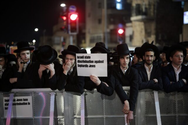 Israeli ultra-Orthodox Jewish youths are protesting plans to end their exemption from mili