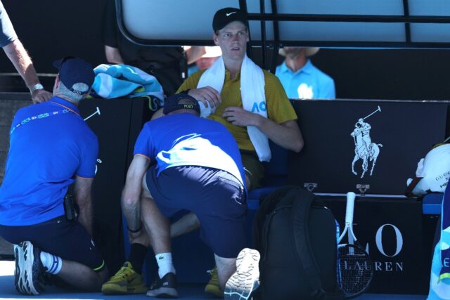 Jannik Sinner gets medical attention between games against Eliot Spizzirri