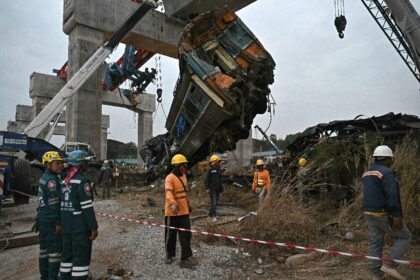 The massive crane's broken structure was left resting on giant concrete pillars, whil
