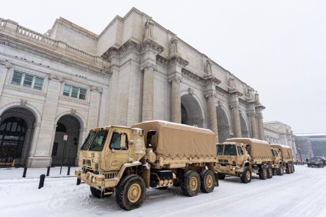 National Guard vehicles are parked outside Union Station in Washington, DC on January 25,