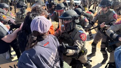 Protestors and law enforcement clash during a demonstration outside the South Texas Family