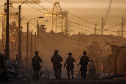 Soldiers patrol among the damage caused by wildfires in southern Chile