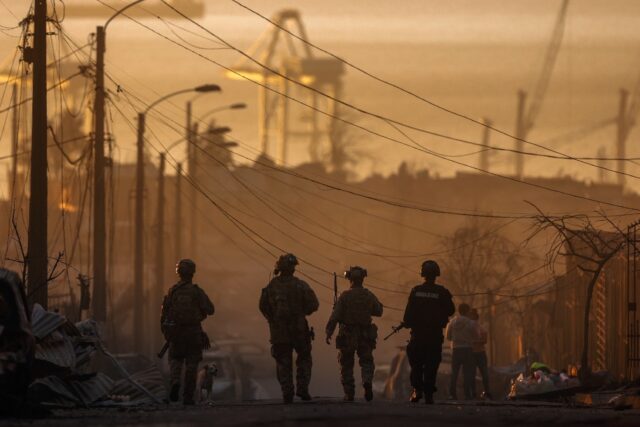 Soldiers patrol among the damage caused by wildfires in southern Chile
