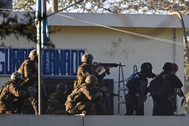 Soldiers take position outside the maximum-security prison in Escuintla, Guatemala