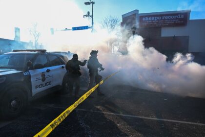 Tear gas is deployed by law enforcement in Minneapolis as demonstrators gather near the si
