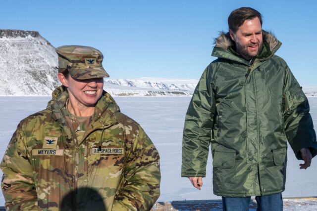 US Vice President JD Vance (R) walks with Colonel Susan Meyers, commander of the US milita