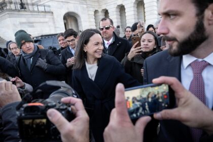 Venezuelan opposition leader Maria Corina Machado (C) said she presented her Nobel Peace P