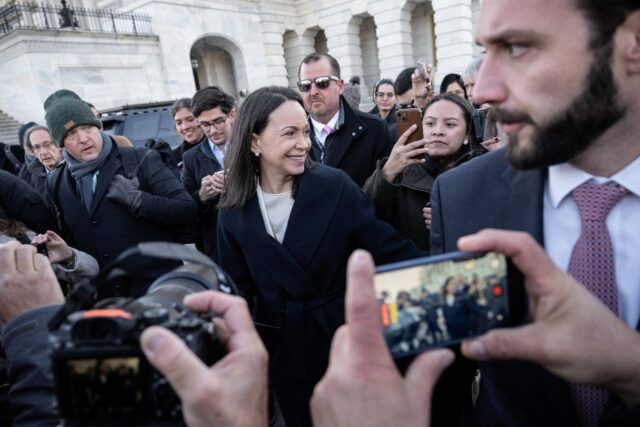 Venezuelan opposition leader Maria Corina Machado (C) said she presented her Nobel Peace P