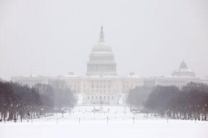 Washington awoke to a blanket of snow expected to cause travel headaches for days