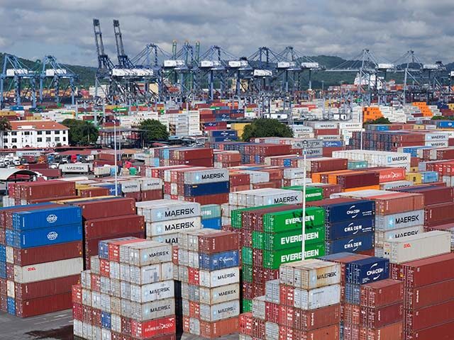 Title: Panama Canal Image ID: 25263858588442 Article: Ship containers are stacked at the P