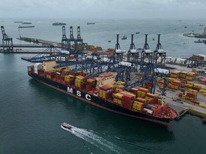 Title: Panama Canal Image ID: 26037853421241 Article: Cranes load and unload containers fr