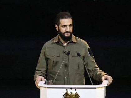 Syrian President Ahmed al-Sharaa delivers a speech during a ceremony at the Convention Cen