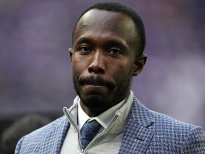 Minnesota Vikings general manager Kwesi Adofo-Mensah wanders the sidelines ahead of an NFL