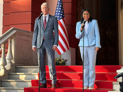 Venezuelan interim president Delcy Rodriguez (R) and US Secretary of Energy Chris Wright (