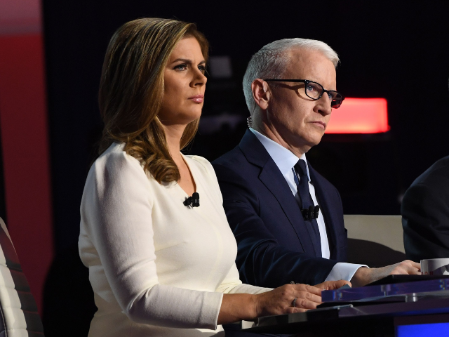 Moderator and The New York Times national editor Marc Lacey (R), moderator and CNN anchor
