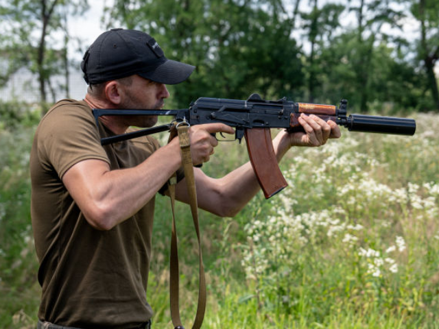 KHARKIV, UKRAINE - JULY 20: A Ukrainian is seen testing a volunteer-made suppressor on the