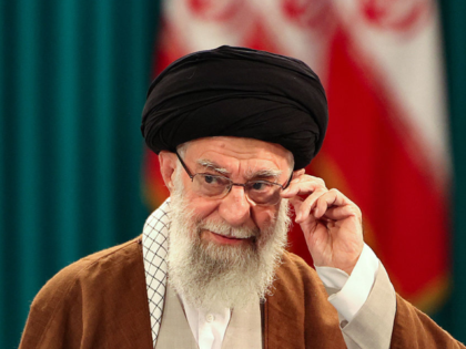 TOPSHOT - Iran's Supreme Leader Ayatollah Ali Khamenei adjusts his eyeglasses during a pre