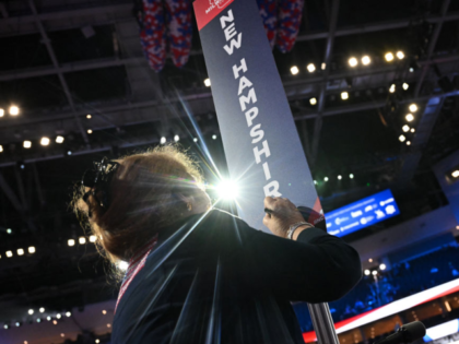 A delegate signs the New Hampshire post during the last day of the 2024 Republican Nationa