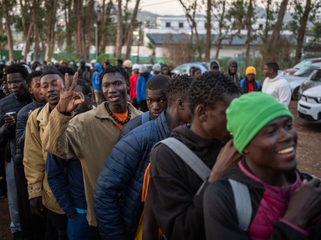 TENERIFE, CANARY ISLANDS, SPAIN - DECEMBER 28: Hundreds of migrants wait in line to receiv