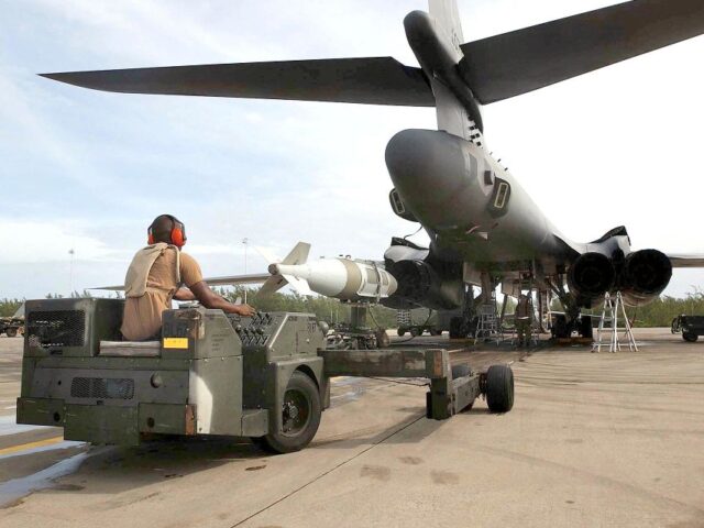 US-ATTACKS-ENDURING FREEDOM-AIR FORCE A US Air Force weapons loader delivers a 2,000lbs bomb for loading into a B1 bomber 22 Oct