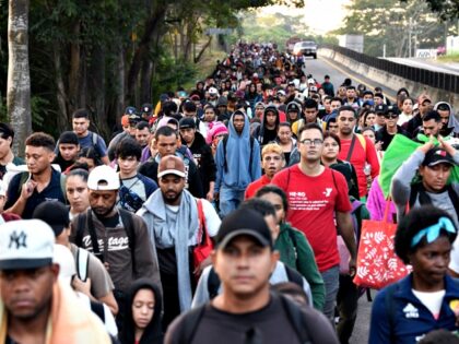 Migrants from a caravan in Tapachula, Chiapas state, Mexico, march while heading to the US