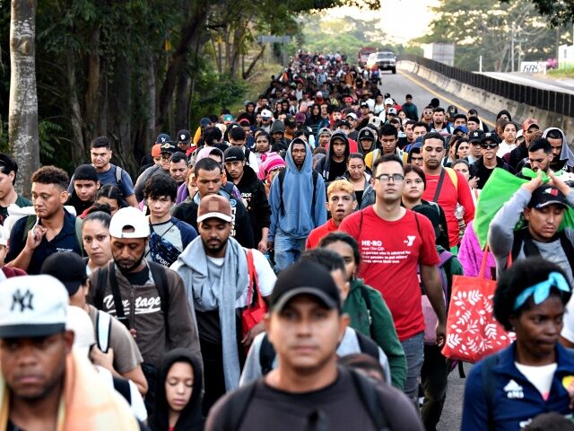 Migrants from a caravan in Tapachula, Chiapas state, Mexico, march while heading to the US
