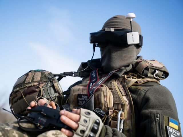 A Ukrainian soldier performs a trial with an FPV drone in the region of Kharkiv, Ukraine,