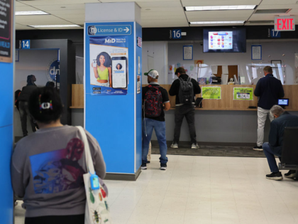 NEW YORK, NEW YORK - APRIL 28: People wait to be called at the New York State DMV on April