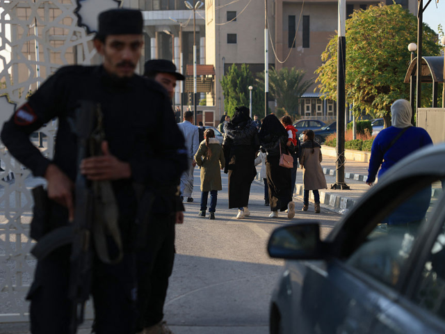 People leave after attending the first trial of more than a dozen suspects linked to massa