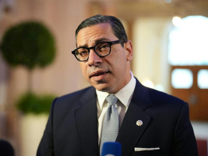 Cyprus' Foreign Minister Constantinos Kombos speaks to media arriving for a Ministerial Co