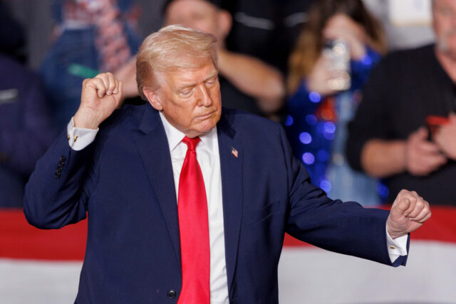 US President Donald Trump dances as he departs following an event in Clive, Iowa, US, on T